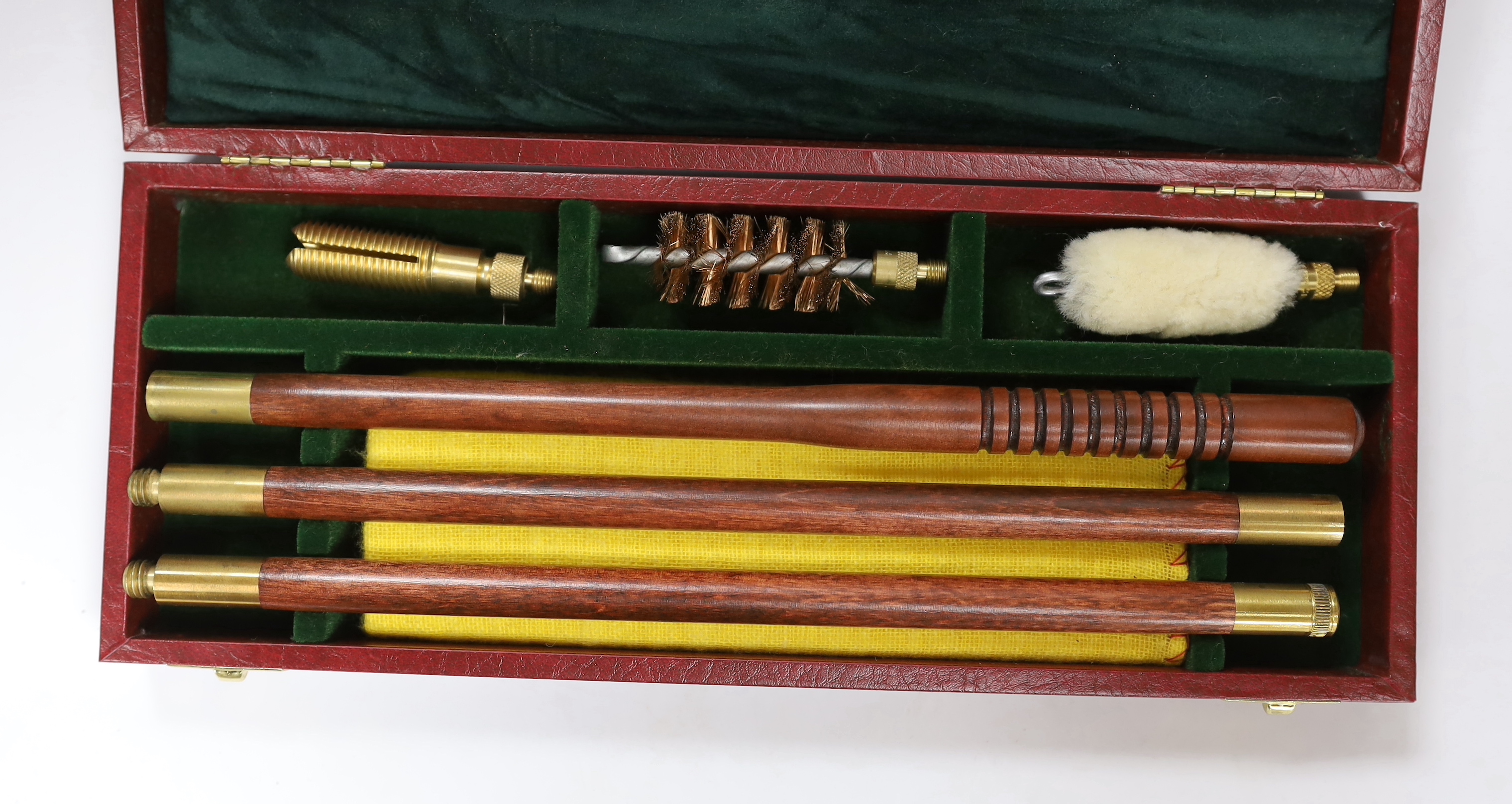 Three copper powder flasks, a leather powder flask, two powder measures and two cases of cleaning tools